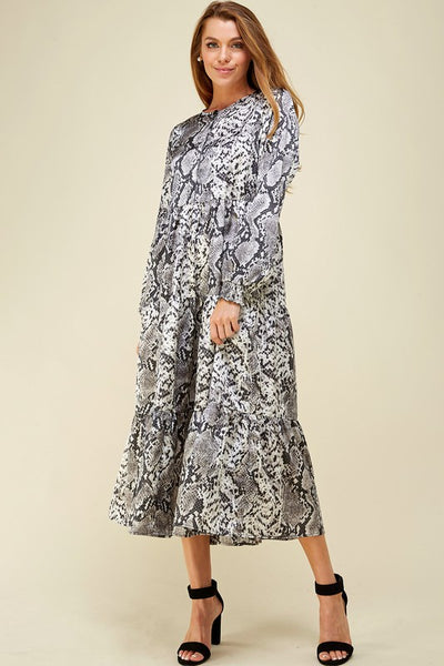 Beautiful snake skin print in greys on long sleeve button bodice tiered skirt maxi dress.