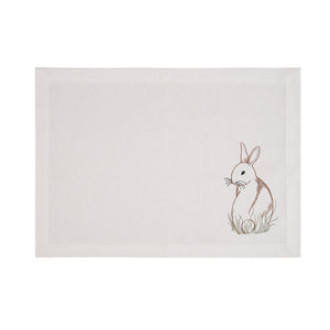Easter decor ideas include these beautifully embroidered white placemats with vintage-inspired bunny.