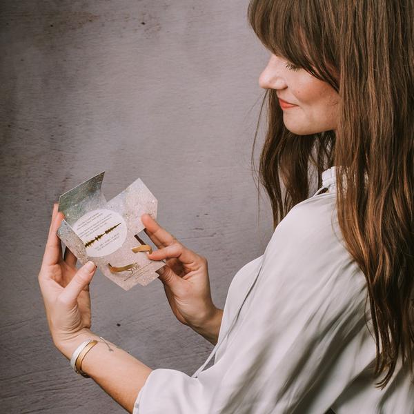 Unique Jewelry with Meaning for Women. Image of echo cuff bracelet packaging with meaning of bracelet on inside of packaging.