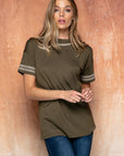 Cute embroidered tops for women. Olive with embroidered edge. Paired with jeans.