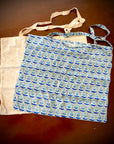 Reusable grocery bags foldable. Yellow wave pattern and gray and blue floral pattern.