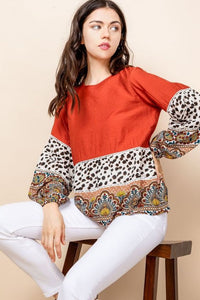 Long sleeved animal print and paisley blouse.