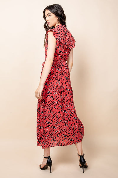 Back view of red animal print maxi with ruffle sleeve and ruffle at back yoke.