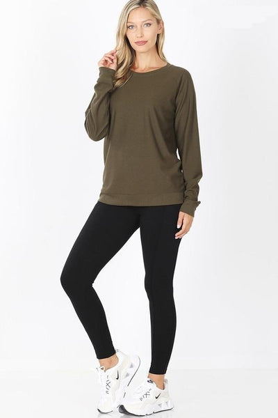 French terry top in other color shown with black leggings and running shoes.