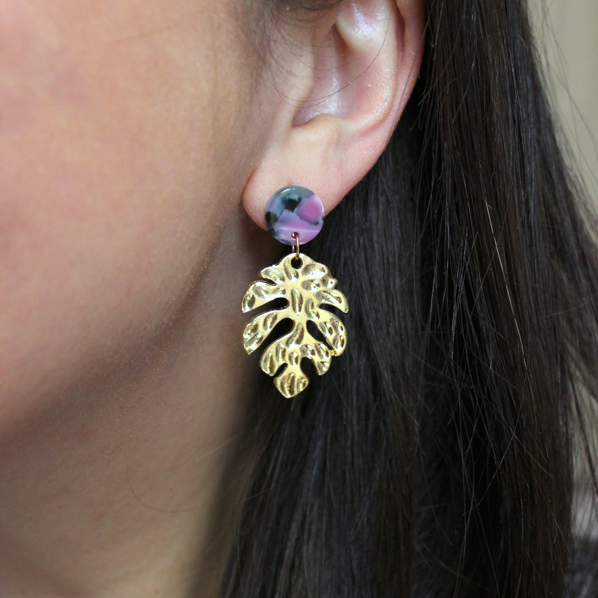 Gold leaf earrings with hot pink and teal acrylic stud.