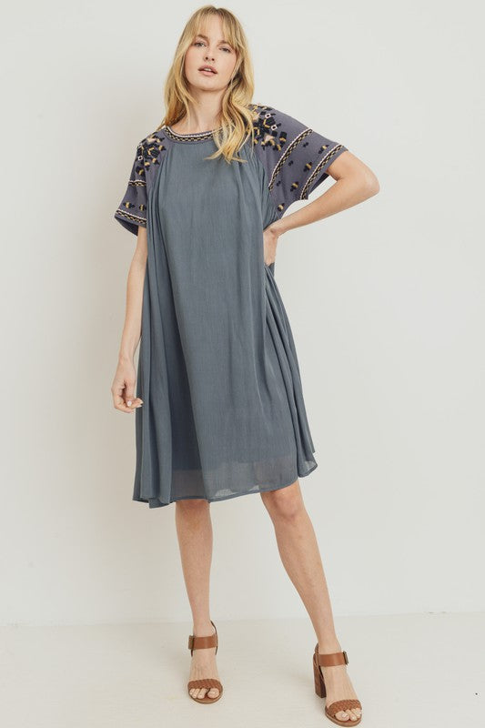 Boho dresses for women. Grey loose fit with embroidery at sleeves, neckline, and yoke.