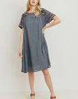 Boho dresses for women. Grey loose fit with embroidery at sleeves, neckline, and yoke.