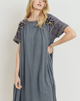 Closer view of grey boho dress for women. Short sleeve. Loose fit.