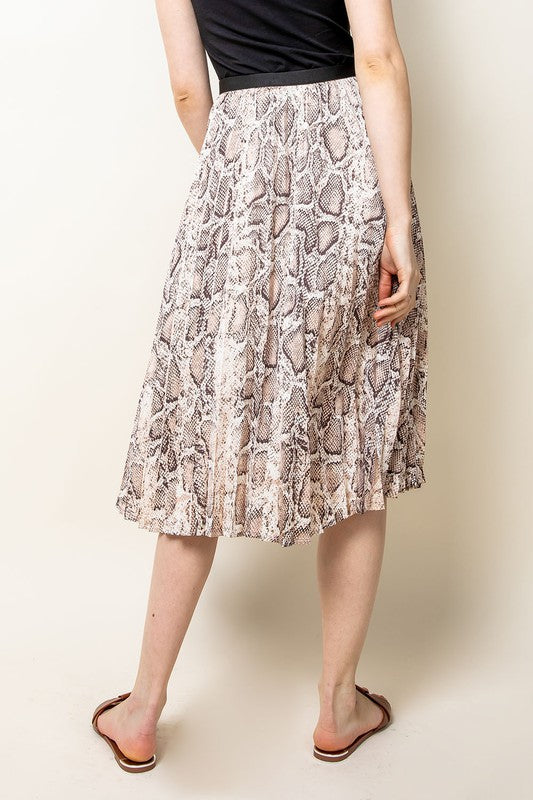 Back view of elastic waist pleated midi skirt in snake skin print.