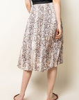 Back view of elastic waist pleated midi skirt in snake skin print.