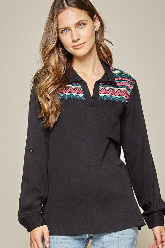Boho tops for women. Black collared v-neck with southwestern embroidery along front and back yoke.