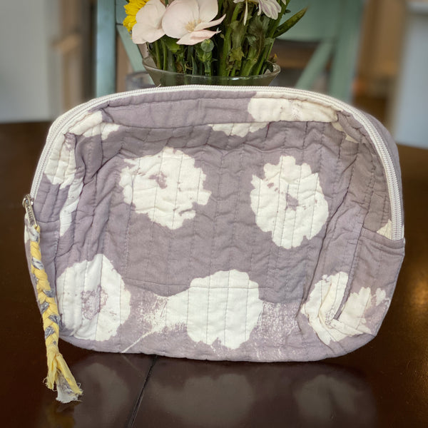 Gray purple cotton travel pouch with yellow pull.
