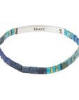 Silver and cobalt glass bead miyuki bracelet with silver bar with "Brave" stamped on inside.