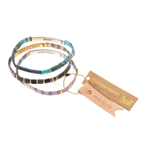 Stack of miyuki bracelets in multiple colors.