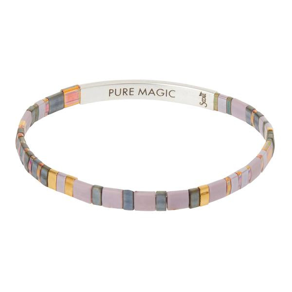 &quot;Pure Magic&quot; engraved on inside of silver bar on dusk colored glass bead miyuki bracelet.