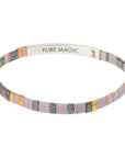 "Pure Magic" engraved on inside of silver bar on dusk colored glass bead miyuki bracelet.