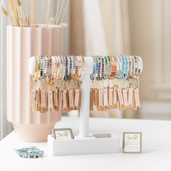 Miyuki bracelets with colorful glass beads. Glass miyuki bracelets on display bar.