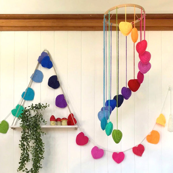 Unique baby gifts. Rainbow heart mobile in nursery.