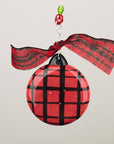 Back of Our first Christmas ornament with red and black plaid design.