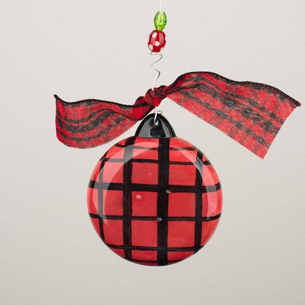 Back of Our first Christmas ornament with red and black plaid design.