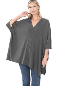 Oversized lightweight poncho in ash grey with short sleeves and v-neck.