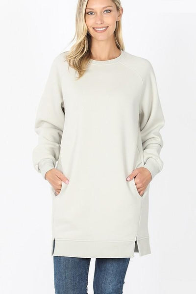 Women's oversized long tunic sweatshirt with side pockets in bone color.