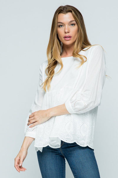 All white boho embroidered top with fuller fit and good length.