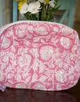 Cotton travel pouch in pink and white pattern.