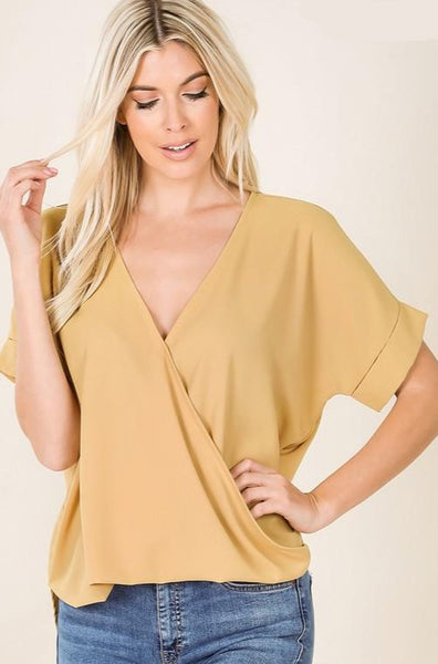 Faux front tuck with permanent rolled short sleeves and v-neck in light mustard.
