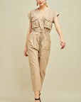 Women's jumpsuit with sleeves in khaki cargo cut with drawstring waist, cap sleeves, and button front. Straight leg.