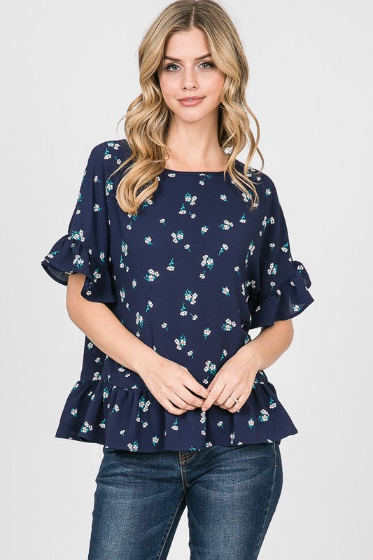 Peplum top short sleeve with ruffle in navy with small floral print.