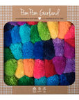 Rainbow pom pom garland in box.