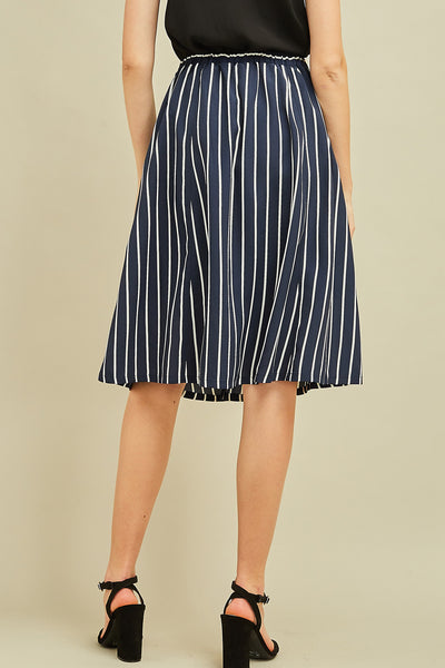 Back view of navy striped women's midi skirt with elastic waist.