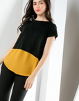 Women's black short sleeve knit top with gold poly contrast hem.