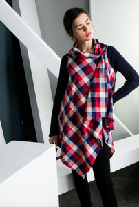 Festive women's plaid cardigan with drape front shown buttoned up on shoulder. 