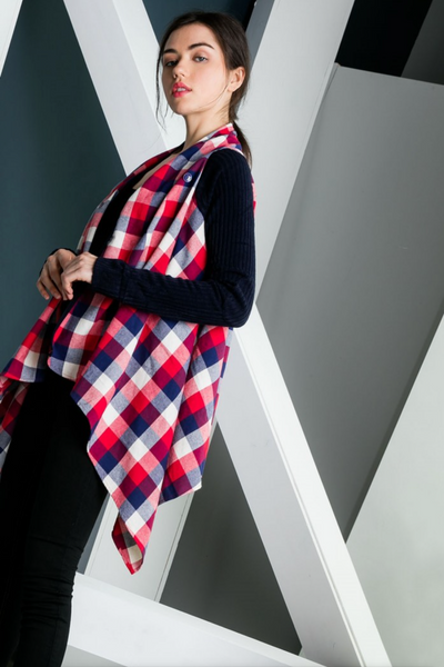 Side view of Festive women's plaid cardigan with drape front. Red and blue plaid bodice with solid navy arms.