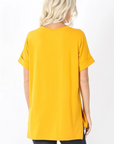 back view of Basic Tees Women: Short sleeve v-neck with rolled sleeve mustard