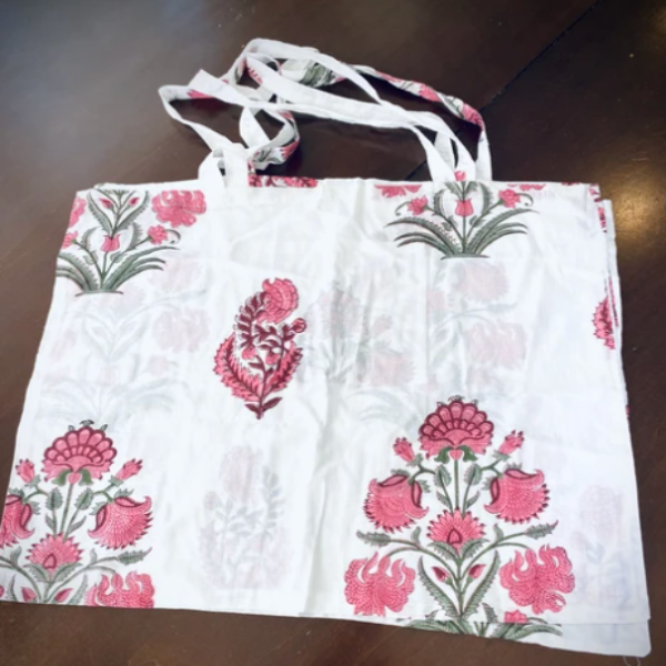 Reusable grocery bags foldable. White and pink floral print.