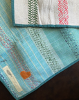 Kantha personal quilt in light blue pattern.