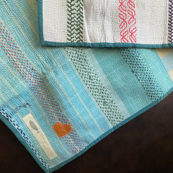 Kantha personal quilt in light blue pattern.