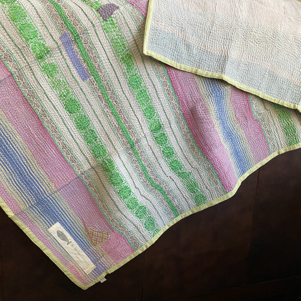 Kantha personal quilt in pastel striped pattern.