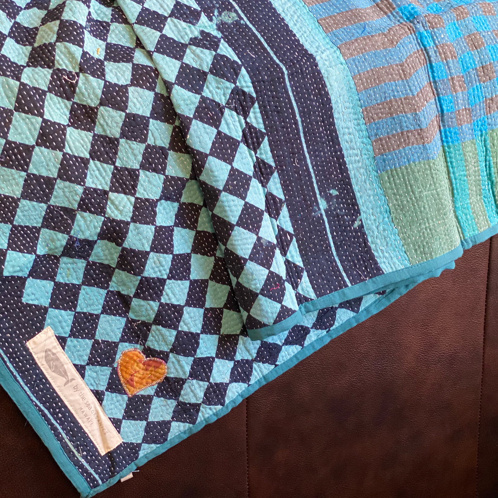 Kantha personal quilt in aqua check pattern.