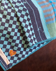 Kantha personal quilt in aqua check pattern.