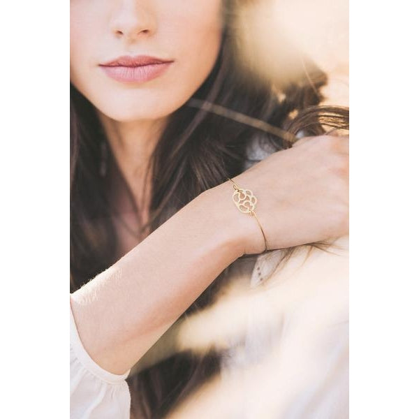 Jewelry with a purpose. Signature bracelet in gold..