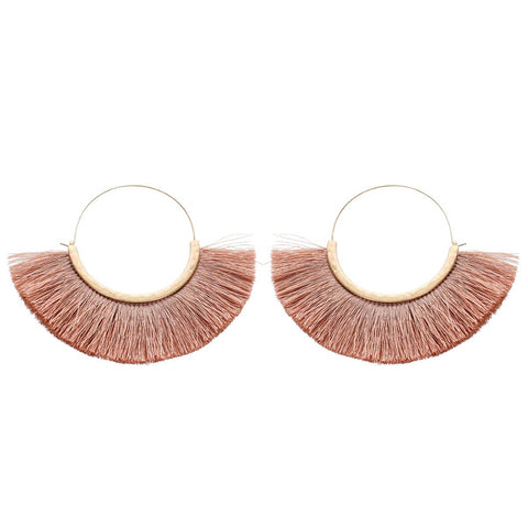 Large statement fringe hoop earrings with mauve colored silk fringe/tassel on gold wire hoop.