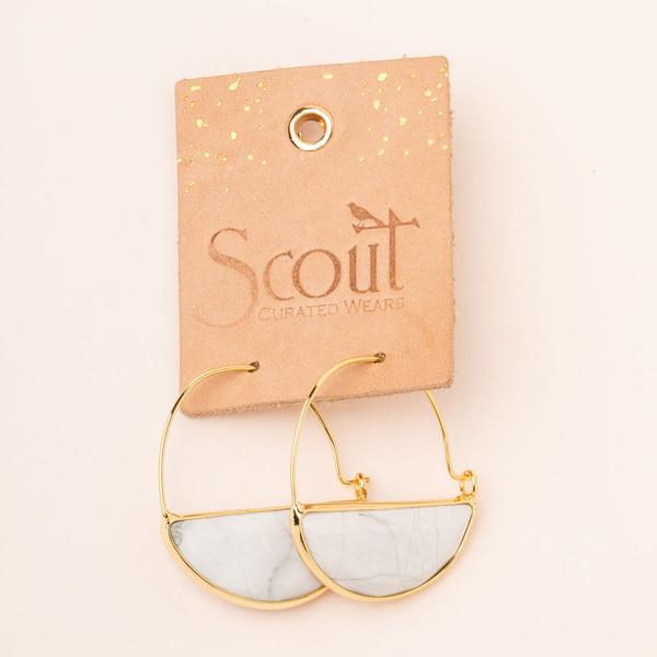 Stone hoop earrings in howlite and gold on leather display card.