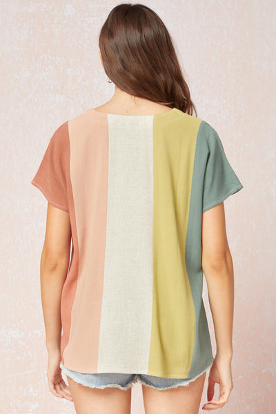 Back view of Women's linen top. Colorblock vertical stripes with v-neck and short sleeves.
