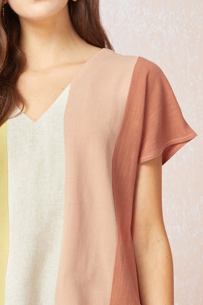 Close up of front of Women's linen top. Colorblock vertical stripes with v-neck and short sleeves.