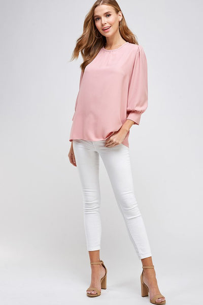 Cute 3/4 sleeve blouse with cuffs in dusty rose with good length hitting slightly below hips.