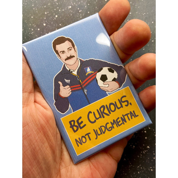 Blue Ted Lasso "Be Curious, Not Judgmental" magnet.